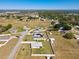 Aerial view captures the neighborhood layout; this property offers large, fenced backyard at 12524 Garrett Pl, Grand Island, FL 32735
