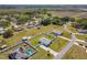 An aerial view of the home showing the fenced yard and a neighborhood view at 12524 Garrett Pl, Grand Island, FL 32735