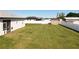 Aerial view of backyard featuring lush green grass and perimeter white fence at 12524 Garrett Pl, Grand Island, FL 32735