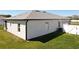This backyard features a well-maintained lawn, creating a welcoming outdoor space at 12524 Garrett Pl, Grand Island, FL 32735