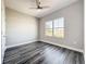 Bright bedroom features wood-look floors and large window at 12524 Garrett Pl, Grand Island, FL 32735