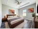 Well-lit bedroom with neutral tones, modern décor, and a comfortable king-size bed at 12524 Garrett Pl, Grand Island, FL 32735