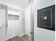 Walk-in closet with custom built-in shelving and safe at 12524 Garrett Pl, Grand Island, FL 32735