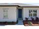 A home's front exterior with a well-manicured lawn and a walkway to the front door at 12524 Garrett Pl, Grand Island, FL 32735
