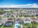 Scenic aerial view of a residential neighborhood with lush landscaping and a tranquil lake at 12627 Boggy Pointe Dr, Orlando, FL 32824