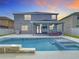 A perfect backyard for entertaining featuring a sparkling pool, covered patio, and outdoor kitchen area at 12627 Boggy Pointe Dr, Orlando, FL 32824