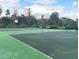 Community basketball court with multiple hoops and benches at 12627 Boggy Pointe Dr, Orlando, FL 32824
