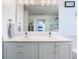 Bathroom boasts a double vanity with chrome faucets and large, well lit mirror at 12627 Boggy Pointe Dr, Orlando, FL 32824
