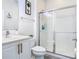 Bright bathroom with a modern vanity, toilet, and a glass-enclosed shower at 12627 Boggy Pointe Dr, Orlando, FL 32824