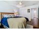 Bright bedroom featuring a comfortable bed, ceiling fan, and modern decor at 12627 Boggy Pointe Dr, Orlando, FL 32824