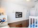 Bright bedroom features stylish half-painted walls and dark hardwood floors at 12627 Boggy Pointe Dr, Orlando, FL 32824