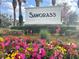 Landscaped entrance sign for the Sawgrass community at 12627 Boggy Pointe Dr, Orlando, FL 32824