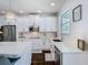 Bright kitchen featuring white cabinetry and stainless steel appliances with backyard view at 12627 Boggy Pointe Dr, Orlando, FL 32824