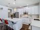 Bright kitchen featuring white cabinetry, stainless steel appliances and pendant lighting at 12627 Boggy Pointe Dr, Orlando, FL 32824