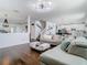 Open-concept layout with living room, staircase, dining area, and kitchen, great for Gathering interactions at 12627 Boggy Pointe Dr, Orlando, FL 32824