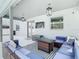Beautiful patio space featuring comfortable seating, a modern fire pit, and a mounted television for outdoor entertainment at 12627 Boggy Pointe Dr, Orlando, FL 32824