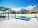 Inviting in-ground pool with a tanning ledge surrounded by a private fenced backyard at 12627 Boggy Pointe Dr, Orlando, FL 32824
