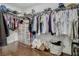 Walk-in closet complete with shelving and rods for efficient storage options at 12627 Boggy Pointe Dr, Orlando, FL 32824