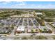 Aerial view of a shopping center with Publix, Subway and more in a beautiful area with lake and greenery at 13042 Michael Callin Aly, Orlando, FL 32828