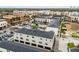 This building features gray exterior, black roofs, multiple garage and street parking spaces, and proximity to shops at 13042 Michael Callin Aly, Orlando, FL 32828