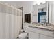 Bathroom featuring a shower/tub combination and granite countertop sink at 13042 Michael Callin Aly, Orlando, FL 32828