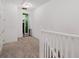 Second floor hallway with carpet and closet space at 13042 Michael Callin Aly, Orlando, FL 32828