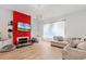 Living room with fireplace and neutral tones at 13042 Michael Callin Aly, Orlando, FL 32828