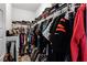 Walk-in closet with shelving, clothing racks, and ample storage at 13042 Michael Callin Aly, Orlando, FL 32828