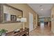 Inviting foyer with decorative mirror, console table, and view to the living and dining areas at 1454 Belle Terre Rd, Davenport, FL 33896