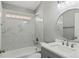 Clean bathroom featuring tub with shower and modern sink with vanity at 15832 Autumn Glen Ave, Clermont, FL 34714