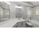 Updated bathroom with marble surround, modern fixtures, and lots of light at 15832 Autumn Glen Ave, Clermont, FL 34714