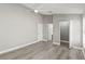 Large bedroom featuring wood floors, a ceiling fan, and a walk-in closet at 15832 Autumn Glen Ave, Clermont, FL 34714