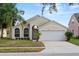 Charming single Gathering home with a well-manicured lawn and attached two car garage at 15832 Autumn Glen Ave, Clermont, FL 34714