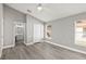 Spacious main bedroom with adjoining bathroom, wood floors, and ceiling fan at 15832 Autumn Glen Ave, Clermont, FL 34714