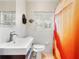 Bathroom with white tile, window shutters, a modern vanity, and a combination shower/tub at 1632 Pinewood Dr, Orlando, FL 32804