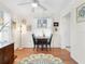 Cozy dining room featuring hardwood floors, a modern ceiling fan, and natural light perfect for Gathering meals at 1632 Pinewood Dr, Orlando, FL 32804