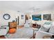 Bright living room featuring hardwood floors, a large TV, and neutral decor that is both inviting and stylish at 1632 Pinewood Dr, Orlando, FL 32804