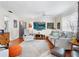 Comfortable living room with hardwood floors, a large TV, and neutral decor that is both inviting and stylish at 1632 Pinewood Dr, Orlando, FL 32804