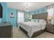 Chic bedroom featuring queen bed, tufted headboard, stylish chandelier, and modern decor at 2217 Lelani Cir, Davenport, FL 33897