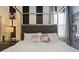 Stylized bedroom with designer bedding, decorative pillows, and contemporary furnishings creating a chic ambiance at 2217 Lelani Cir, Davenport, FL 33897