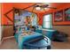 Themed bedroom featuring two twin beds with Moana bedding and vibrant decor at 2217 Lelani Cir, Davenport, FL 33897
