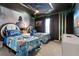 Star Wars themed bedroom featuring twin beds with headboards and themed wallpaper and ceiling at 2217 Lelani Cir, Davenport, FL 33897