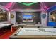 Entertainment-themed game room featuring an air hockey table, pool table, and large screen TV at 2217 Lelani Cir, Davenport, FL 33897