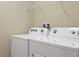 Laundry room featuring washer, dryer, and wire shelving at 2217 Lelani Cir, Davenport, FL 33897