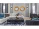 Chic living room with modern decor, comfortable seating, and a view into the dining area at 2217 Lelani Cir, Davenport, FL 33897