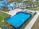Aerial view of a community with basketball and volleyball courts, pool and a clubhouse at 2221 Lelani Cir, Davenport, FL 33897