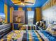 Themed bedroom featuring playful wall decor, twin beds, and themed bedding for a fun atmosphere at 2221 Lelani Cir, Davenport, FL 33897
