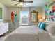 Light and airy bedroom featuring custom-themed surfboards and decor, perfect for creating a relaxing coastal feel at 2221 Lelani Cir, Davenport, FL 33897
