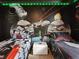 Star Wars themed bedroom with two twin beds, cool lighting, and custom wall art at 2221 Lelani Cir, Davenport, FL 33897