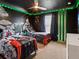 This Star Wars themed bedroom features awesome custom wall art and fun decor at 2221 Lelani Cir, Davenport, FL 33897